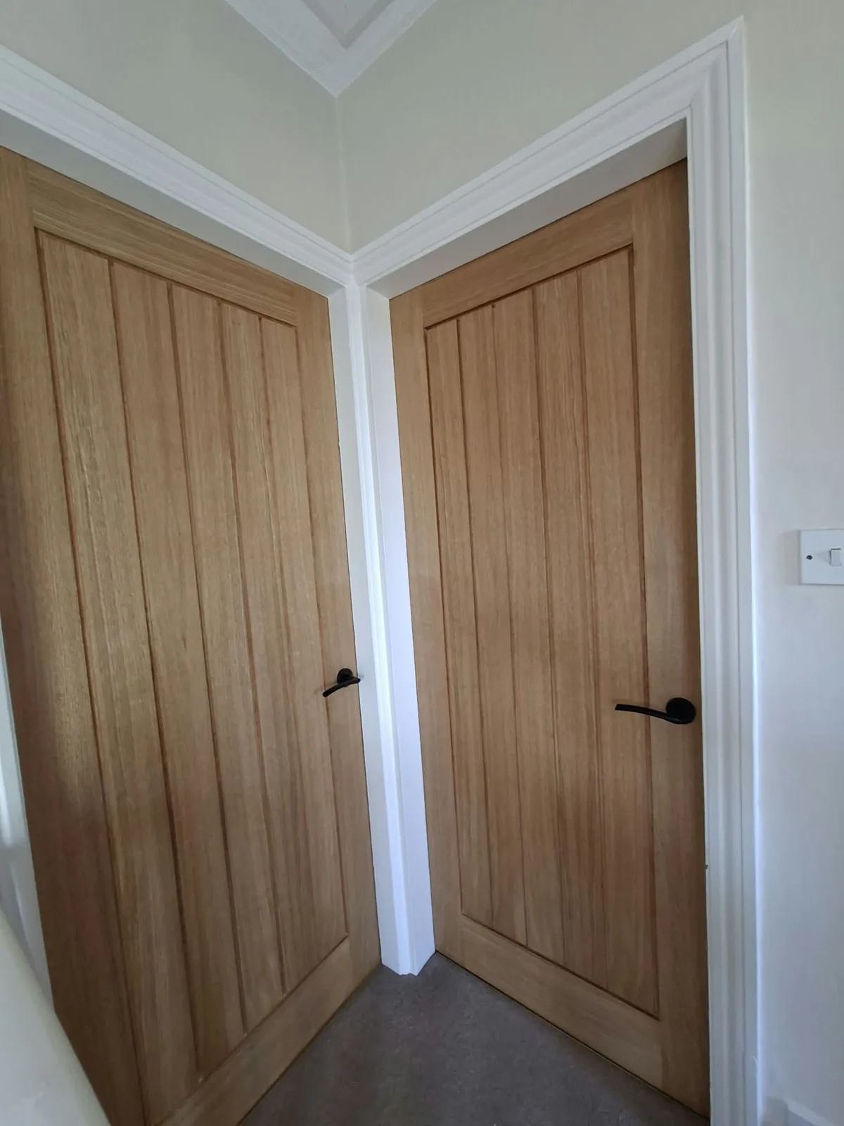 Oak internal door installation with white frame